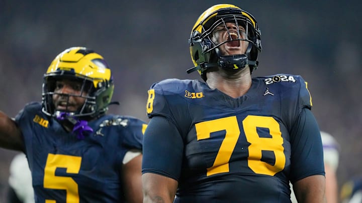 Michigan defensive lineman Kenneth Grant celebrates a sack on Washington quarterback Michael Penix Jr. during the College Football Playoff national championship game against Washington at NRG Stadium in Houston, Texas, on Monday, Jan. 8, 2024.
