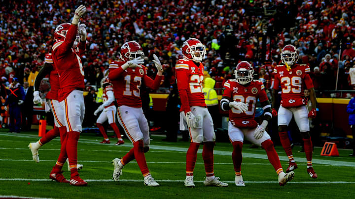 Dec 21, 2024; Kansas City, Missouri, USA; Kansas City Chiefs cornerback Trent McDuffie (22) celebrates with teammates after an interception during the first half against the Houston Texans at GEHA Field at Arrowhead Stadium. Mandatory Credit: Jay Biggerstaff-Imagn Images