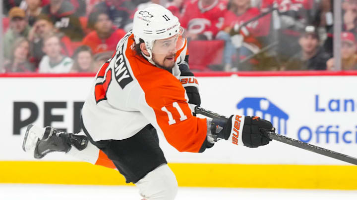 May 4, 2026; Raleigh, North Carolina, USA; Philadelphia Flyers right wing Travis Konecny (11) takes a shot against the Carolina Hurricanes in the first overtime in game two of the second round of the 2026 Stanley Cup Playoffs at Lenovo Center. 