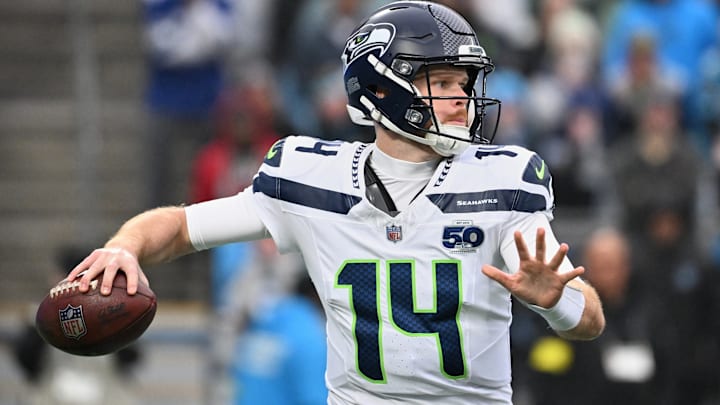 Dec 28, 2025; Charlotte, North Carolina, USA; Seattle Seahawks quarterback Sam Darnold (14) throws a pass against the Carolina Panthers during the first quarter at Bank of America Stadium. 