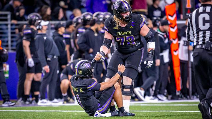 John Mills helps QB Demond Williams Jr. get back on his feet against Minnesota, which is what their team now needs to do. John Mills helps QB Demond Williams Jr. get back on his feet against Minnesota, which is what their team now needs to do.