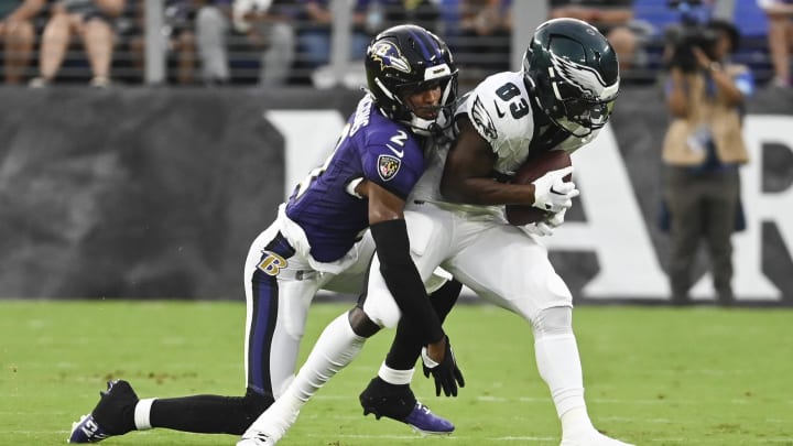 Aug 9, 2024; Baltimore, Maryland, USA;  Philadelphia Eagles wide receiver John Ross (83) makes catch in front of Baltimore Ravens cornerback Nate Wiggins (2) during the first  quarter of a preseason game at M&T Bank Stadium. Mandatory Credit: Tommy Gilligan-USA TODAY Sports