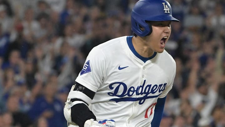 Los Angeles Dodgers superstar Shohei Ohtani (17) celebrates after he singled in the go ahead run in the seventh inning of game against the San Diego Padres at Dodger Stadium.