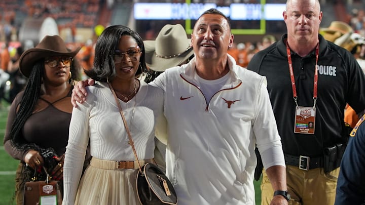 Texas Longhorns head coach Steve Sarkisian and his wife Loreal Sarkisian walk off the field after defeating the Kentucky Wildcats at Darrell K Royal Texas Memorial Stadium. Texas Longhorns head coach Steve Sarkisian and his wife Loreal Sarkisian walk off the field after defeating the Kentucky Wildcats at Darrell K Royal Texas Memorial Stadium.