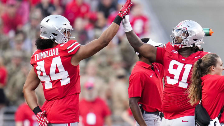 Sep 16, 2023; Columbus, Ohio, USA; Ohio State Buckeyes defensive end JT Tuimoloau (44) high fives defensive tackle Tyleik Williams (91) during the NCAA football game at Ohio Stadium. Ohio State won 63-10. Sep 16, 2023; Columbus, Ohio, USA; Ohio State Buckeyes defensive end JT Tuimoloau (44) high fives defensive tackle Tyleik Williams (91) during the NCAA football game at Ohio Stadium. Ohio State won 63-10.