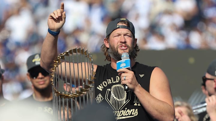 Dodgers pitcher Clayton Kershaw, who announced earlier this season he would retire at the end of the year, speaks to the crowd during the 2025 World Series championship celebration at Dodger Stadium in Los Angeles on Monday, Nov. 3, 2025.