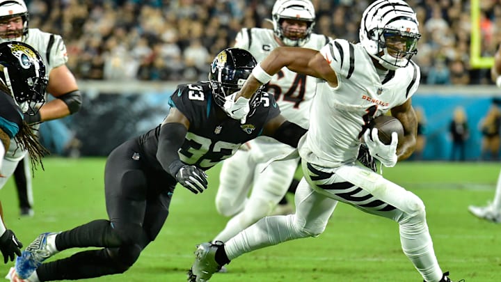 Jacksonville Jaguars linebacker Devin Lloyd (33) chases down Cincinnati Bengals wide receiver Ja'Marr Chase (1), making the tackle just short of the goal line during early fourth quarter action. The Jacksonville Jaguars hosted the Cincinnati Bengals at EverBank Stadium in Jacksonville, Florida for Monday Night Football, December 4, 2023. The Jaguars were tied 14 to 14 at the end of the first half an fell in overtime with a final score of 34 to 31. [Bob Self/Florida Times-Union]