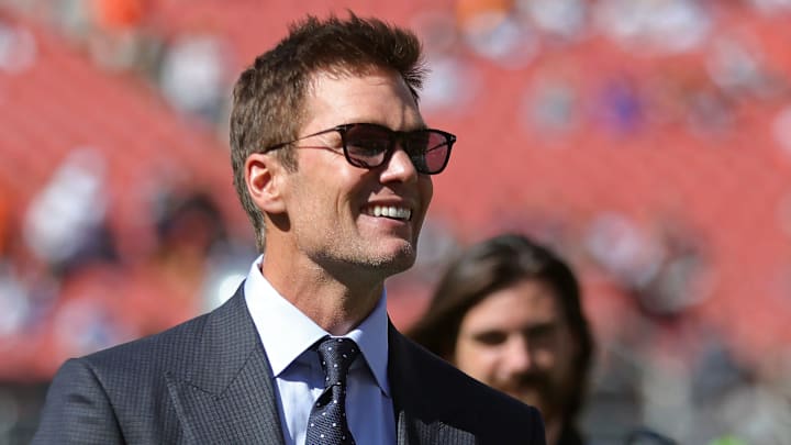 NFL legend Tom Brady is all smiles before an NFL football game at Huntington Bank Field, Sunday, Sept. 8, 2024, in Cleveland, Ohio.