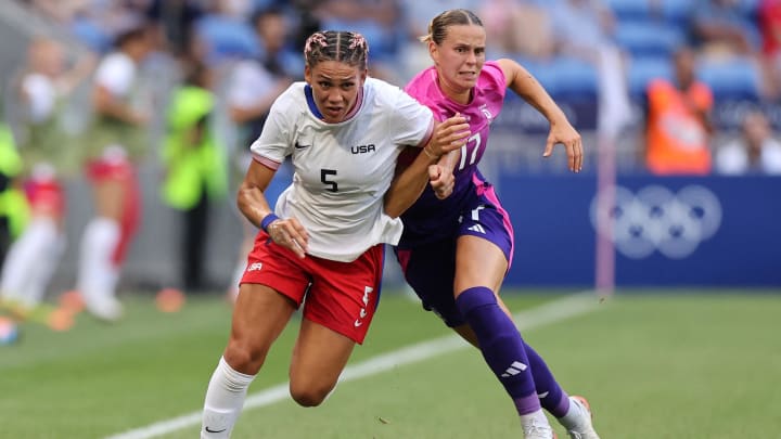 [US, Mexico & Canada customers only]  Aug 6, 2024; Decines-Charpieu, France; Trinity Rodman of the United States in action with Klara Buehl of Germany in a women's football semifinal match during the Paris 2024 Olympic Summer Games at Lyon Stadium. Mandatory Credit: Nir Elias/Reuters via USA TODAY Sports