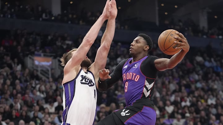 Nov 2, 2024; Toronto, Ontario, CAN; Toronto Raptors guard RJ Barrett (9) goes up to make a basket as Sacramento Kings forward Domantas Sabonis (11) defends during the first half at Scotiabank Arena. Nov 2, 2024; Toronto, Ontario, CAN; Toronto Raptors guard RJ Barrett (9) goes up to make a basket as Sacramento Kings forward Domantas Sabonis (11) defends during the first half at Scotiabank Arena.