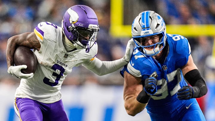 Detroit Lions defensive end Aidan Hutchinson (97) tackles Minnesota Vikings wide receiver Jordan Addison (3) during the second half at Ford Field in Detroit on Sunday, November 2, 2025.