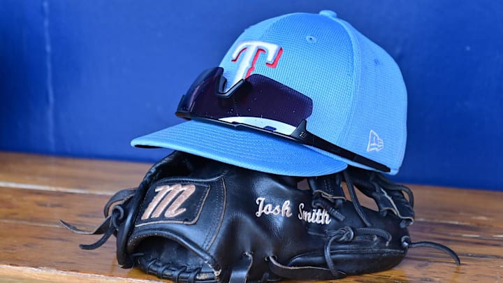 General view of a Texas Rangers hat, glove, and glasses prior to a spring training game. Mandatory Credit: Matt Kartozian-USA TODAY Sports