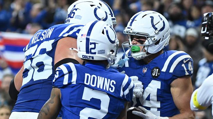 Nov 30, 2025; Indianapolis, Indiana, USA; Indianapolis Colts wide receiver Alec Pierce (14) celebrates after a touchdown with guard Quenton Nelson (56) and wide receiver Josh Downs (2) during the first half against the Houston Texans at Lucas Oil Stadium. Mandatory Credit: Robert Goddin-Imagn Images