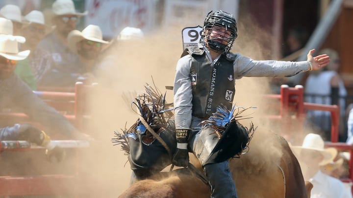The dust flies as bull rider Hayes Thayne Weight, of Goshen, Utah, rides a bull named Longmire The dust flies as bull rider Hayes Thayne Weight, of Goshen, Utah, rides a bull named Longmire