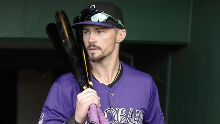 Colorado Rockies center fielder Brenton Doyle (9) enters the dugout.