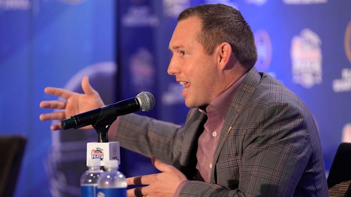 Arizona State head coach Kenny Dillingham responds to a question during a joint news conference with Texas head coach Steve Sarkisian before facing off in the Chick-fil-A Peach Bowl. Arizona State head coach Kenny Dillingham responds to a question during a joint news conference with Texas head coach Steve Sarkisian before facing off in the Chick-fil-A Peach Bowl.