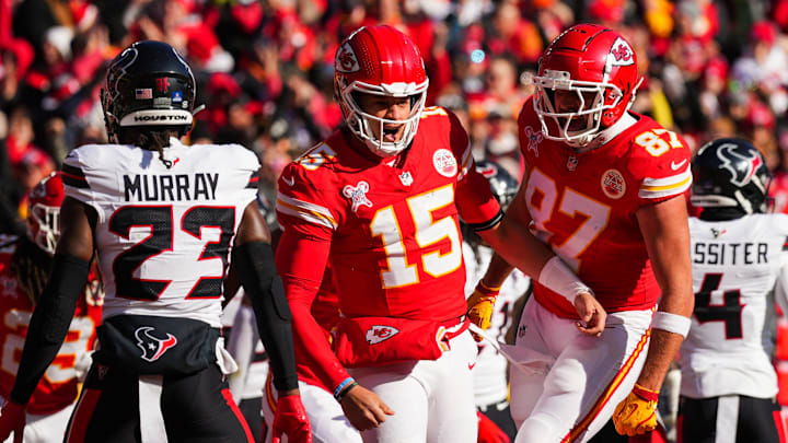 Dec 21, 2024; Kansas City, Missouri, USA; Kansas City Chiefs quarterback Patrick Mahomes (15) celebrates with tight end Travis Kelce (87) after scoring a touchdown during the first half against the Houston Texans at GEHA Field at Arrowhead Stadium. Mandatory Credit: Jay Biggerstaff-Imagn Images