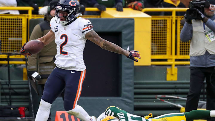 Chicago Bears wide receiver DJ Moore (2) tip-toes the sideline as he breaks a tackle by Green Bay Packers safety Javon Bullard (20) on his way to a 32-yard touchdown reception on Sunday, January 5, 2025, at Lambeau Field in Green Bay, Wis. The Bears won the game, 24-22, on a 51-yard field goal as time expired.
Tork Mason/USA TODAY NETWORK-Wisconsin
