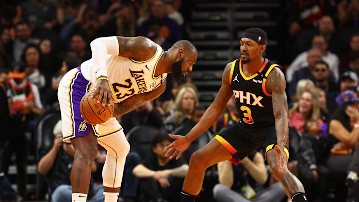 Nov 26, 2024; Phoenix, Arizona, USA; Los Angeles Lakers forward LeBron James (23) against Phoenix Suns guard Bradley Beal (3) during an NBA Cup game at Footprint Center. Mandatory Credit: Mark J. Rebilas-Imagn Images