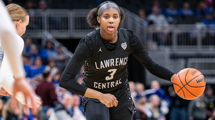 Lawrence Central High School sophomore Lola Lampley (3) drives toward the basket during the second half of an IHSAA class 4A girls    basketball state finals game against Lake Central high School, Saturday, Feb. 24, 2024, at Gainbridge Fieldhouse, in Indianapolis. Lawrence Central won the school   s first state championship title in girl   s basketball.