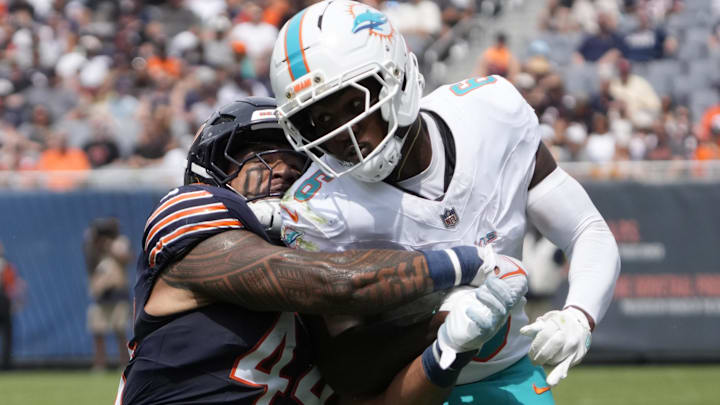 Noah Sewell wraps up Malik Washington during the first half at Soldier Field. Sewell, Austin Booker and the backup defense had their day.