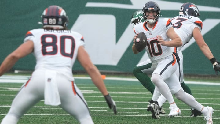 East Rutherford, NJ -- September 29 -- Quarterback, Bo Nix of Denver looks to throw to Greg Dulcich in the first half as the Denver Broncos edged the New York Jets 10-9 at MetLife Stadium.