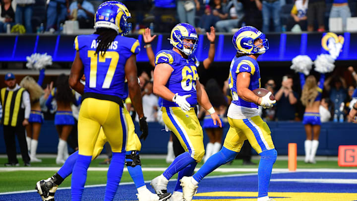 Sep 28, 2025; Inglewood, California, USA; Los Angeles Rams wide receiver Puka Nacua (12) celebrates his touchdown scored against the Indianapolis Colts with center Coleman Shelton (65) and wide receiver Davante Adams (17) during the second half at SoFi Stadium. Mandatory Credit: Gary A. Vasquez-Imagn Images Sep 28, 2025; Inglewood, California, USA; Los Angeles Rams wide receiver Puka Nacua (12) celebrates his touchdown scored against the Indianapolis Colts with center Coleman Shelton (65) and wide receiver Davante Adams (17) during the second half at SoFi Stadium. Mandatory Credit: Gary A. Vasquez-Imagn Images
