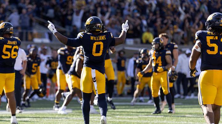 Oct 10, 2026; Berkeley, California, USA;  California Golden Bears players celebrate their 25-20 victory over the Virginia Tech Hokies at California Memorial Stadium.  Mandatory Credit: D. Ross Cameron-Imagn Images