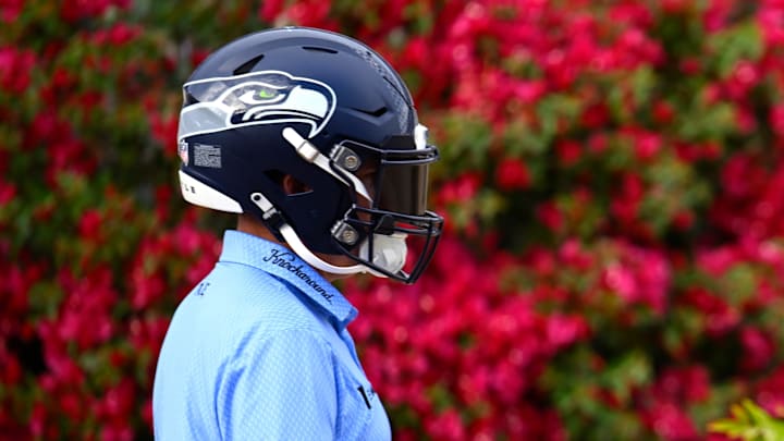 Joel Dahmen threw on a Seahawks helmet while walking to his tee shot on the 16th hole.