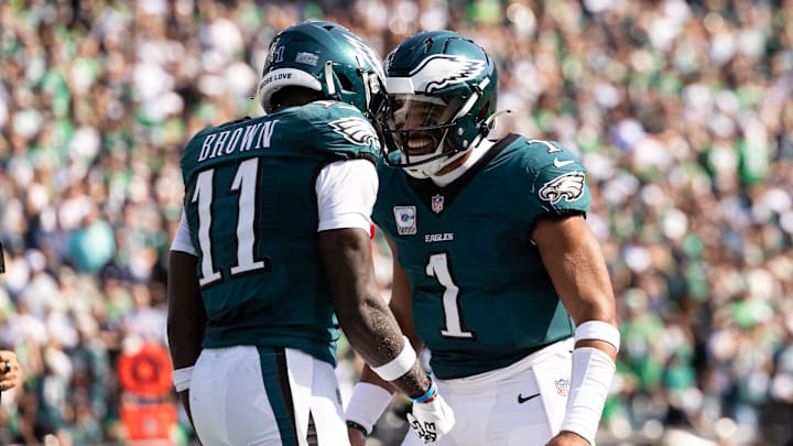 Oct 13, 2024; Philadelphia, Pennsylvania, USA; Philadelphia Eagles quarterback Jalen Hurts (1) and wide receiver A.J. Brown (11) celebrate their touchdown pass during the second quarter against the Cleveland Browns at Lincoln Financial Field. Mandatory Credit: Bill Streicher-Imagn Images