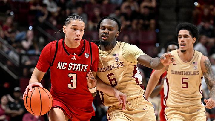 Jan 10, 2026; Tallahassee, Florida, USA; North Carolina State Wolfpack guard Matt Able (3) drives the ball up the court past Florida State Seminoles guard Robert McCray (6) during the first half at Donald L. Tucker Center. Mandatory Credit: Melina Myers-Imagn Images