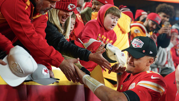 Dec 8, 2024; Kansas City, Missouri, USA; Kansas City Chiefs quarterback Patrick Mahomes (15) greets fans while leaving the field after the win over the Los Angeles Chargers at GEHA Field at Arrowhead Stadium. Mandatory Credit: Denny Medley-Imagn Images