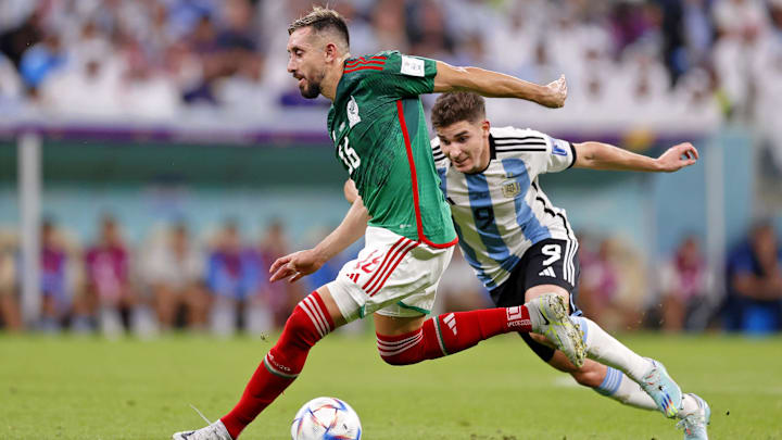 Nov 26, 2022; Lusail, Qatar; Mexico midfielder Hector Herrera (16) dribbles the ball while defended