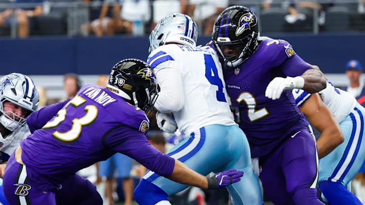 Baltimore Ravens defensive tackle Nnamdi Madubuike (92) and Baltimore Ravens linebacker Kyle Van Noy (53) tackle Dallas Cowboys quarterback Dak Prescott (4) during the first half at AT&T Stadium. 