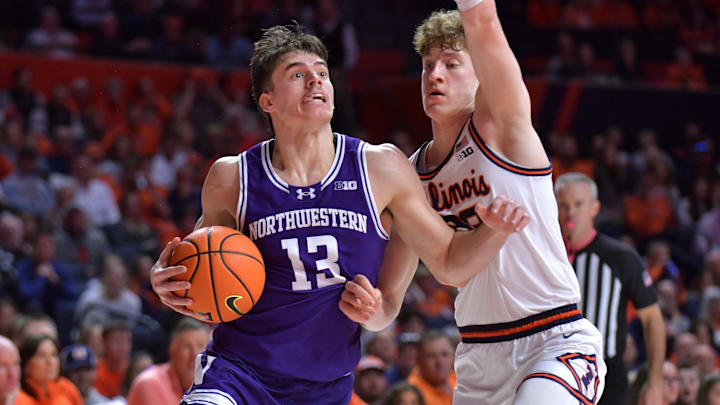 Jan 26, 2025; Champaign, Illinois, USA; Northwestern Wildcats guard Brooks Barnhizer (13) drives the ball against Illinois Fighting Illini guard Kasparas Jakucionis (32) during the second half at State Farm Center. Mandatory Credit: Ron Johnson-Imagn Images Jan 26, 2025; Champaign, Illinois, USA; Northwestern Wildcats guard Brooks Barnhizer (13) drives the ball against Illinois Fighting Illini guard Kasparas Jakucionis (32) during the second half at State Farm Center. Mandatory Credit: Ron Johnson-Imagn Images
