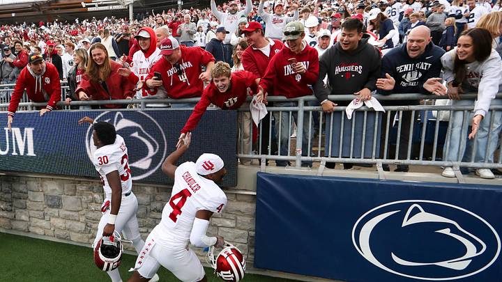 Indiana Hoosiers players Davion Chandler (4) and linebacker PJ Nelson (30) celebrate with the fans following a win over the Penn State Nittany Lions at Beaver Stadium. Indiana Hoosiers players Davion Chandler (4) and linebacker PJ Nelson (30) celebrate with the fans following a win over the Penn State Nittany Lions at Beaver Stadium.