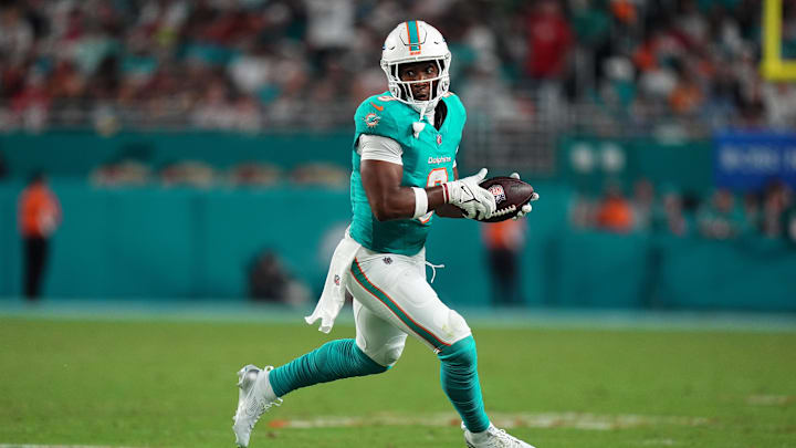 Dec 22, 2024; Miami Gardens, Florida, USA; Miami Dolphins tight end Jonnu Smith (9) runs the ball after a catch against the San Francisco 49ers during second half at Hard Rock Stadium. Mandatory Credit: Jasen Vinlove-Imagn Images
