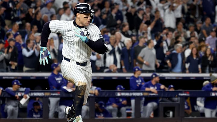 Oct 30, 2024; New York, New York, USA; New York Yankees outfielder Aaron Judge (99) doubles during the eighth inning against the Los Angeles Dodgers in game five of the 2024 MLB World Series at Yankee Stadium.