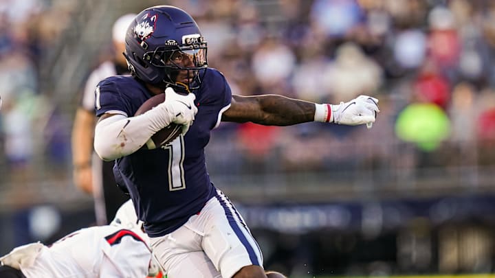Sep 20, 2025; East Hartford, Connecticut, USA; Connecticut Huskies wide receiver Skyler Bell (1) runs the ball against et Ball State Cardinals in the second half at Pratt & Whitney Stadium at Rentschler Field. Mandatory Credit: David Butler II-Imagn Images Sep 20, 2025; East Hartford, Connecticut, USA; Connecticut Huskies wide receiver Skyler Bell (1) runs the ball against et Ball State Cardinals in the second half at Pratt & Whitney Stadium at Rentschler Field. Mandatory Credit: David Butler II-Imagn Images