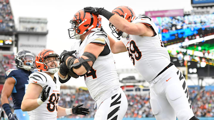 Dec 15, 2024; Nashville, Tennessee, USA;  Cincinnati Bengals defensive end Sam Hubbard (94) celebrates scoring a touchdown with tight end Drew Sample (89) in the first half against the Tennessee Titans at Nissan Stadium. Mandatory Credit: Steve Roberts-Imagn Images