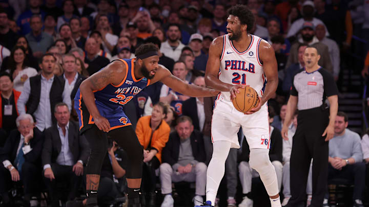 Apr 30, 2024; New York, New York, USA; Philadelphia 76ers center Joel Embiid (21) controls the ball against New York Knicks center Mitchell Robinson (23) during the fourth quarter of game 5 of the first round of the 2024 NBA playoffs at Madison Square Garden. Mandatory Credit: Brad Penner-Imagn Images