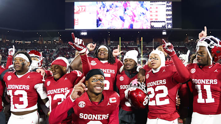 Oklahoma players celebrate the Sooners' return to the College Football Playoff.