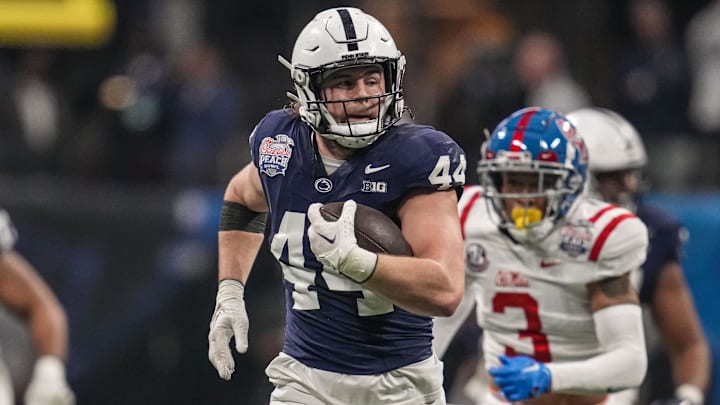 Dec 30, 2023; Atlanta, GA, USA; Penn State Nittany Lions tight end Tyler Warren (44) runs for a long gain after a catch against the Mississippi Rebels during the first half at Mercedes-Benz Stadium. 