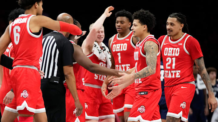 Teammates celebrate a three pointer by Ohio State Buckeyes guard John Mobley Jr. (0) during the second half of the NCAA men's basketball game against the Penn State Nittany Lions at the Schottenstein Center in Columbus on Jan. 26, 2026. Ohio State won 84-78.