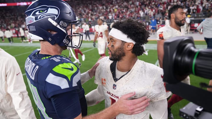 Arizona Cardinals quarterback Kyler Murray (1) meets Seattle Seahawks quarterback Sam Darnold (14) after the Seahawks' 23-20 win at State Farm Stadium in Glendale on Sept. 25, 2025.