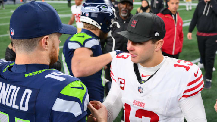 Seattle Seahawks quarterback Sam Darnold (14) and San Francisco 49ers quarterback Brock Purdy (13)