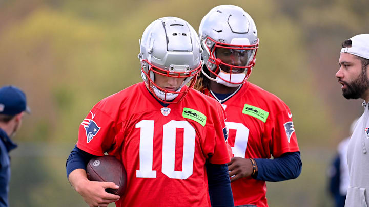 May 11, 2024; Foxborough, MA, USA; New England Patriots quarterback Drake Maye (10) (front) and New England Patriots quarterback Joe Milton III (19)(back) work out at the New England Patriots rookie camp at Gillette Stadium.  Mandatory Credit: Eric Canha-Imagn Images