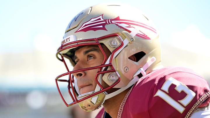 Oct 7, 2023; Tallahassee, Florida, USA; Florida State Seminoles quarterback Jordan Travis (13) warms up before the game against the Virginia Tech Hokies at Doak S. Campbell Stadium. Mandatory Credit: Melina Myers-Imagn Images