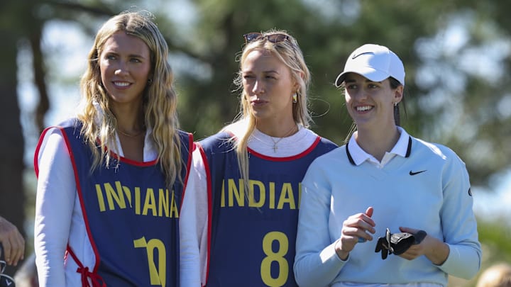 Nov 12, 2025; Belleair, Florida, USA; Indiana Fever guard Sophie Cunningham (8) and guard Lexie Hull (10) look on as guard Caitlin Clark (22) plays in the Annika Pro-Am golf tournament at Pelican Golf Club. Mandatory Credit: Nathan Ray Seebeck-Imagn Images