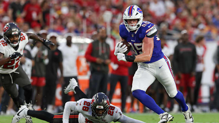 Aug 23, 2025; Tampa, Florida, USA; Buffalo Bills tight end Jackson Hawes (85) runs past Tampa Bay Buccaneers safety Shilo Sanders (28) in the first quarter at Raymond James Stadium. Mandatory Credit: Nathan Ray Seebeck-Imagn Images